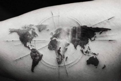 world travel tattoo on arm in black and white