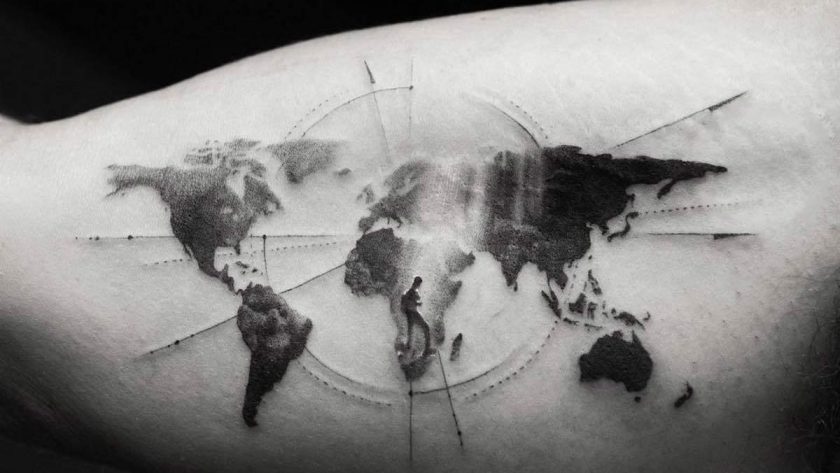 world travel tattoo on arm in black and white