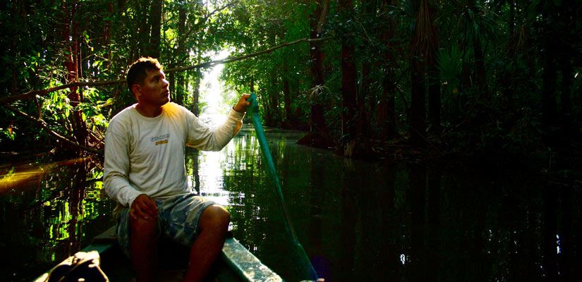 tour guide in a boat lake sandoval