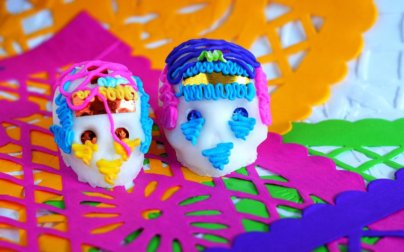 White sugar skulls with colorful decorations