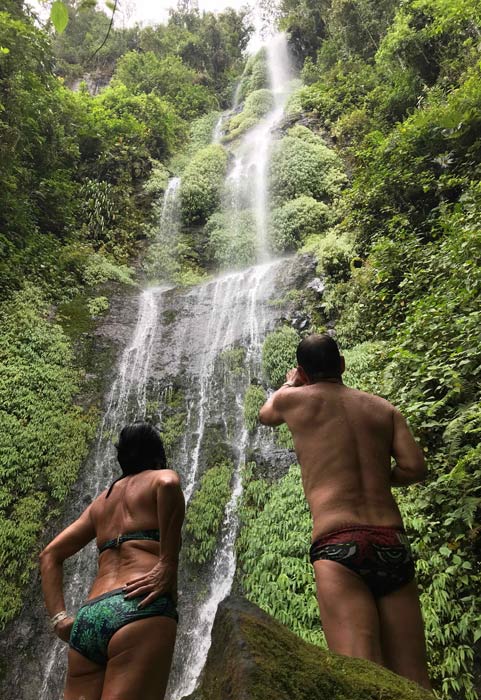 people in hot springs waterfalls
