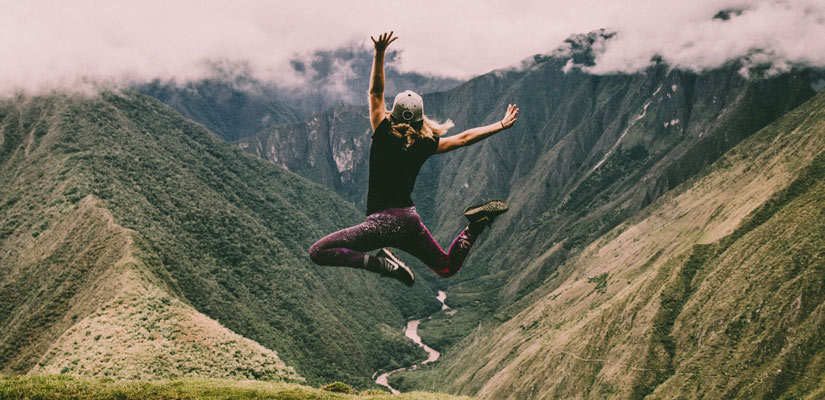 traveler jumping in inca trail