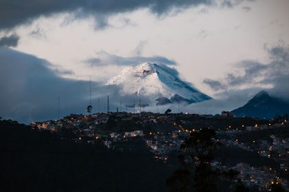 city of quito with volcano in the background