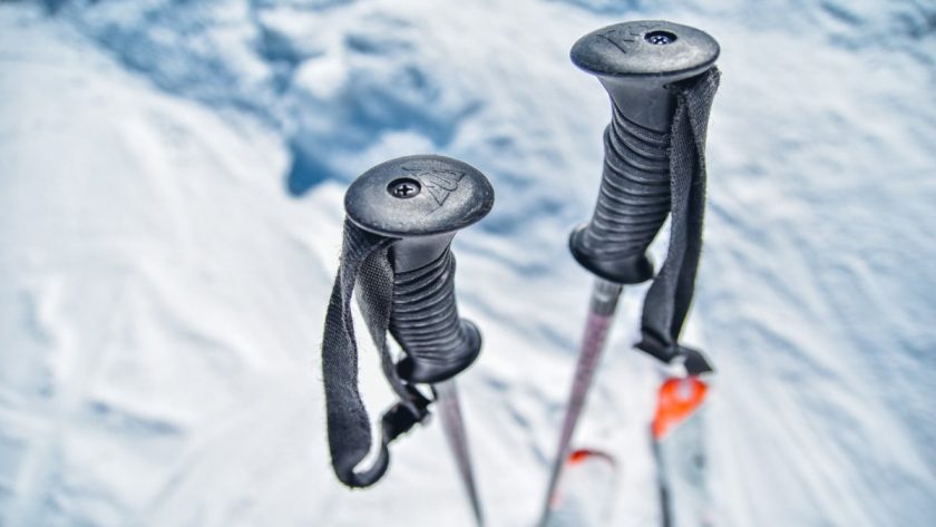 trekking poles in the snow