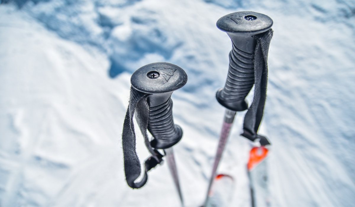 trekking poles in the snow