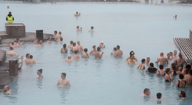icelanders swimming in a hot spring pool