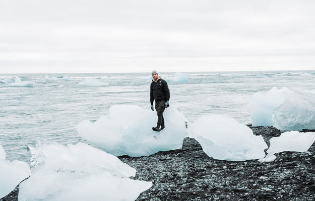 traveler on ice in Iceland